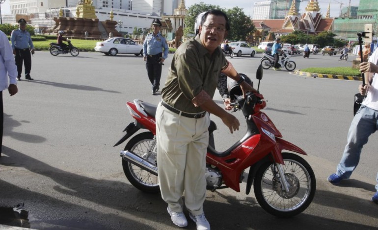 Cambodian PM fined for helmet less riding